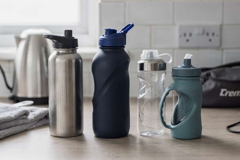 Assorted durable sports water bottles with various cap designs and insulation types displayed for comparison.