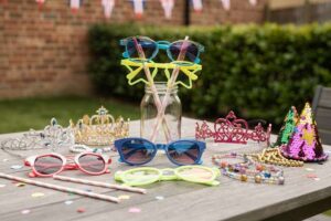 Colorful novelty glasses and festive eyewear accessories arranged for UK celebrations and special events.