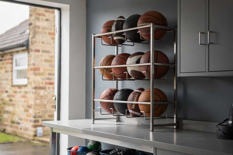 Organized sports equipment storage solutions displaying various ball lockers and racks for gym and facility management.