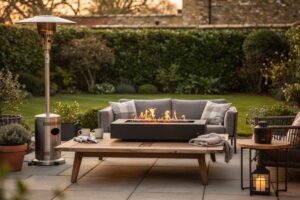 Modern patio heaters and fire pit options arranged on a garden terrace with seating areas.