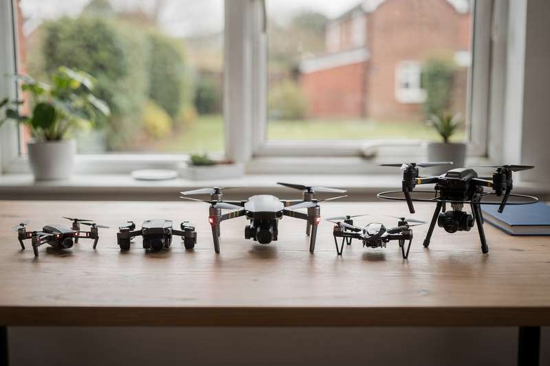 Selection of modern drones ranging from beginner-friendly quadcopters to professional-grade models for UK enthusiasts.