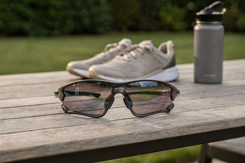 Assorted sports sunglasses with UV protection displayed for UK fitness enthusiasts.