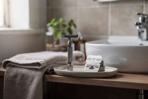 Top-rated men's razor blades arranged on a bathroom counter showcasing different brands and blade types.